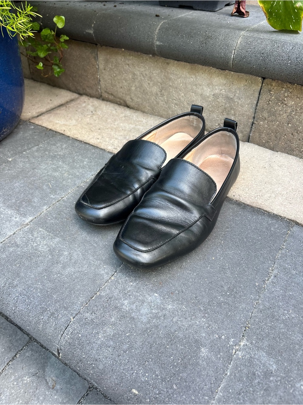 Tory Burch black leather slip ons - size 10